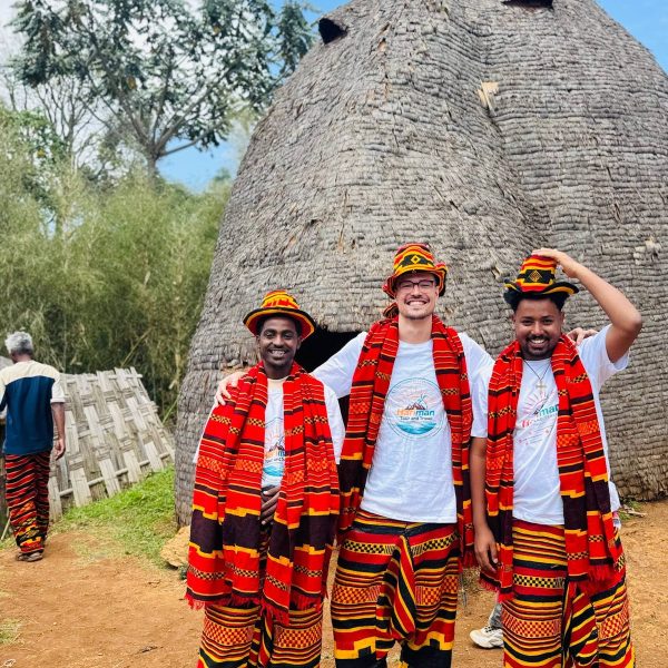 Hariman travelers wearing traditional handwoven Dorze attire in southern Ethiopia