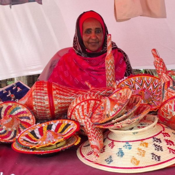 Harari woman with colourful handwoven baskets