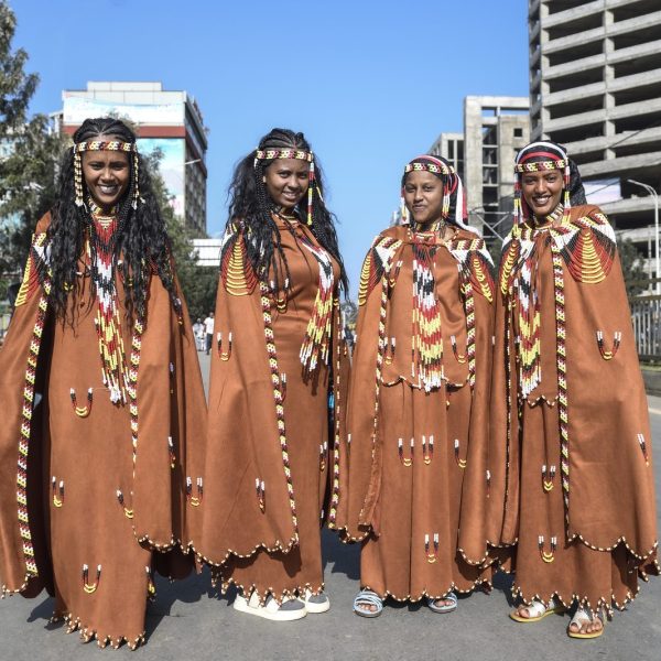 Women in traditional Oromo leather dresses at Irreecha